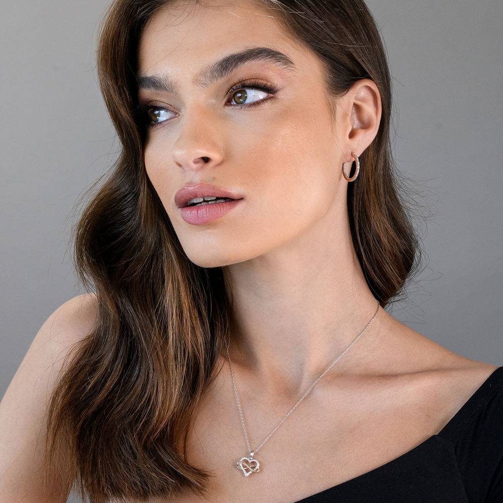 1/10 CT. T.W. Diamond Heart Pendant in Sterling Silver with Rose Gold Plated Infinity Interlocked-4 product photo