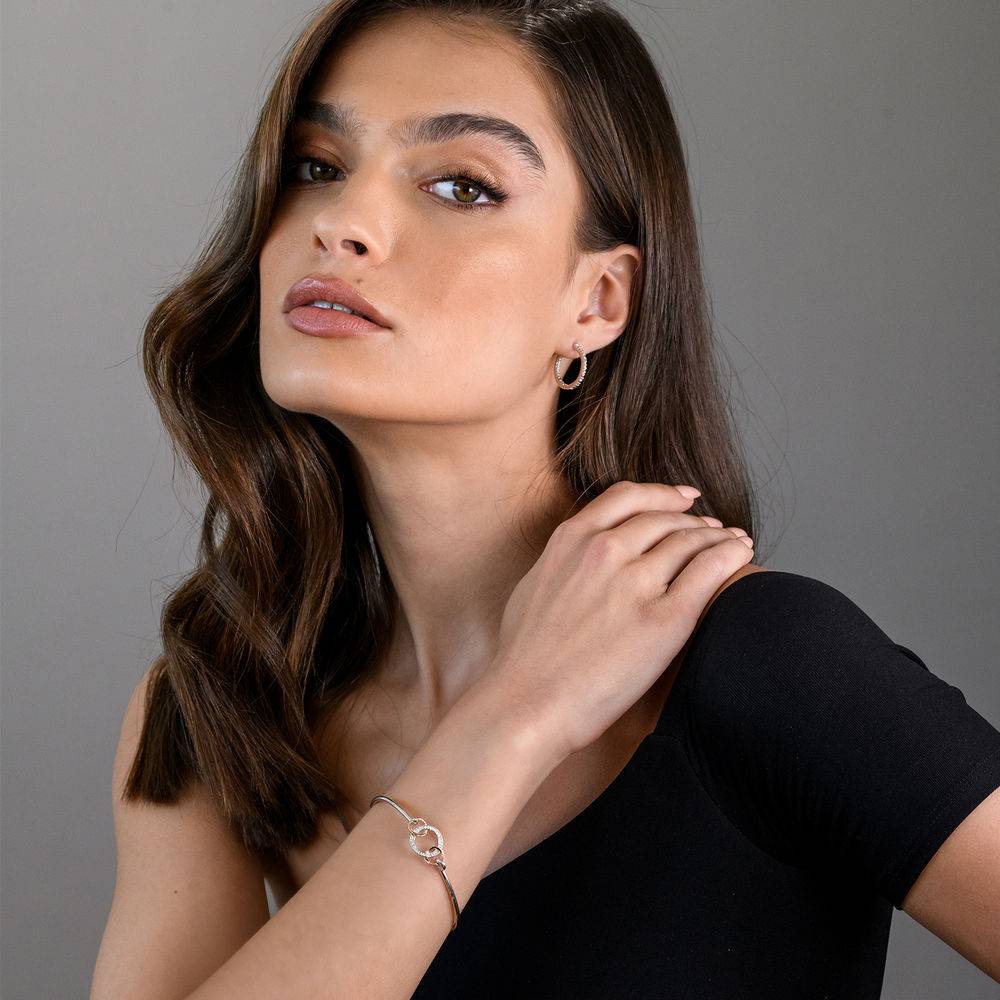 1/10 CT. T.W. Diamond Infinity Circle Bangle in Sterling Silver with Rose Gold Plated details-3 product photo