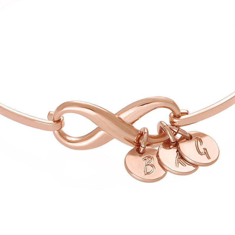Infinity Bangle Bracelet with Initial Charms in Rose Gold Plating-2 product photo