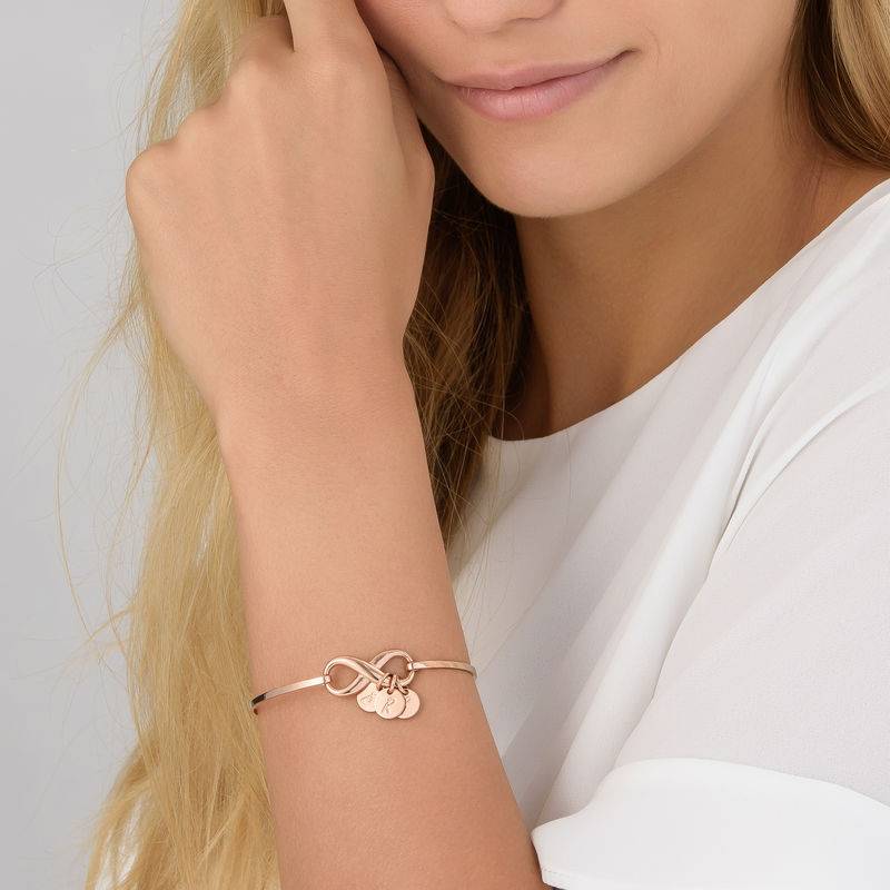Infinity Bangle Bracelet with Initial Charms in Rose Gold Plating-3 product photo